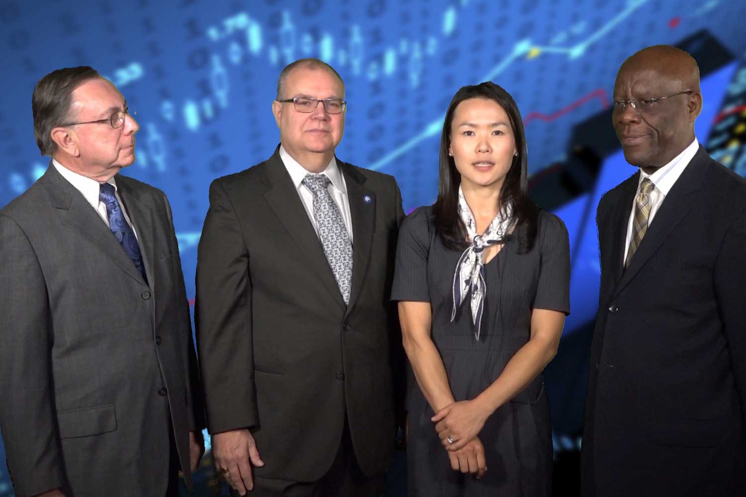 A screenshot of a video of four people in front of a virtual background.